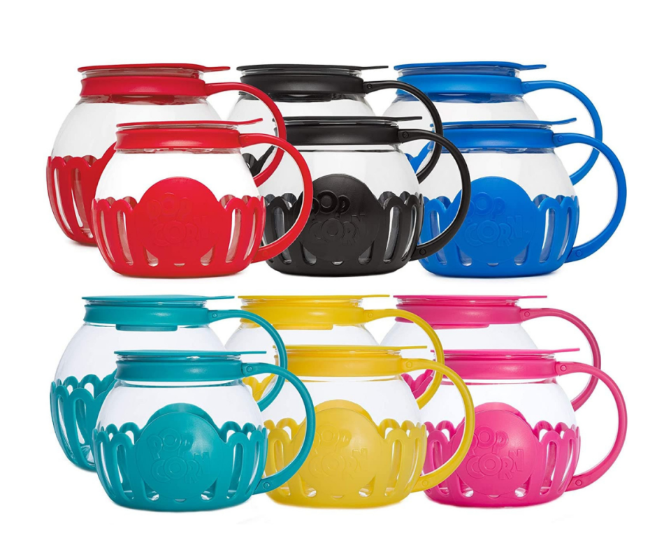 Two rows of three popcorn popper pots, with red, black and blue on top and green, yellow and pink beneath on a white background.