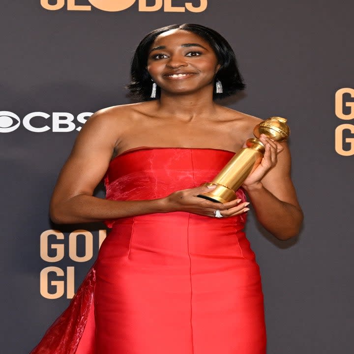 Ayo Edebiri holding her Golden Globe