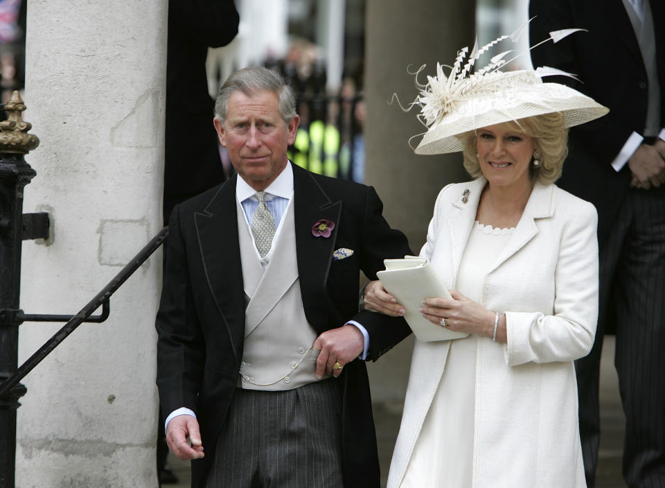WINDSOR, ENGLAND - APRIL 09:  TRH Prince Charles, the Prince of Wales, and his wife Camilla, the Duchess of Cornwall, depart the Civil Ceremony where they were legally married, at The Guildhall, Windsor on April 9, 2005 in Berkshire, England.  (Photo by Georges De Keerle/Getty Images)