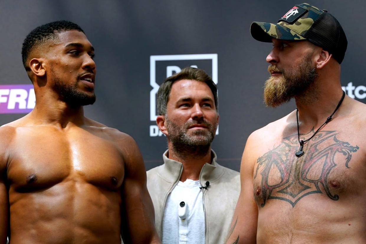 Anthony Joshua, left, and Robert Helenius after weighing in (PA)