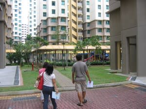 People walking under some flats