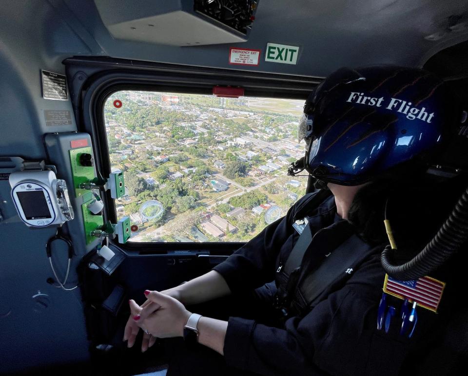 First Flight paramedic April Inganna gazes out the window during a flight over Melbourne.