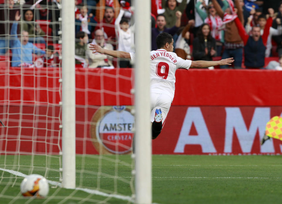 Sevilla's Wissam Ben Yedder celebrates after scoring his side's opening goal during the Europa League round of 32 second leg soccer match between Sevilla and Lazio at the Sanchez Pizjuan stadium, in Seville, Spain, Wednesday, Feb. 20, 2019. (AP Photo/Miguel Morenatti)