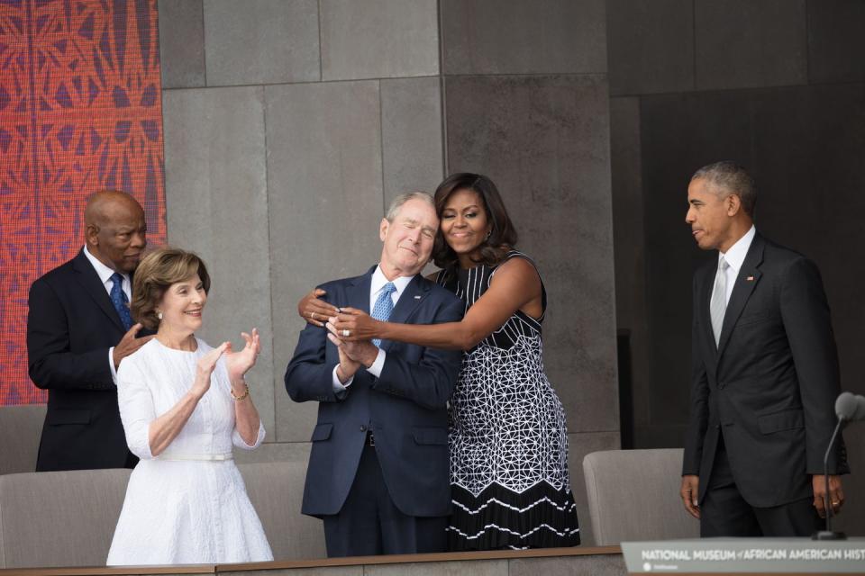 <p>First Lady Michelle Obama hugs former President George W. Bush at the opening of the National Museum of African American History and Culture in Washington, DC, on September 24, 2016.</p>