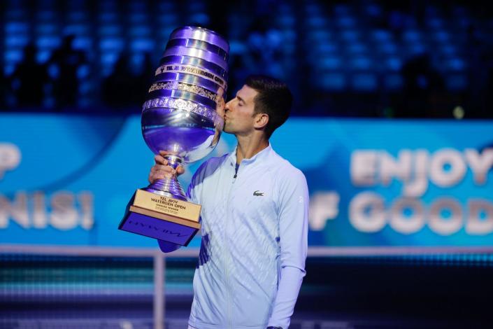 Serbia's Novak Djokovic poses with the trophy after winning against Marin Cilic of Croatia in the final match of the Tel Aviv Watergen open tournament, in Tel Aviv, Israel.