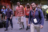 Kansas City Chiefs tight end Travis Kelce, center left, and singer Taylor Swift leave Arrowhead stadium after an NFL football game between the Chiefs and the Los Angeles Chargers, Sunday, Oct. 22, 2023, in Kansas City, Mo. (AP Photo/Charlie Riedel)