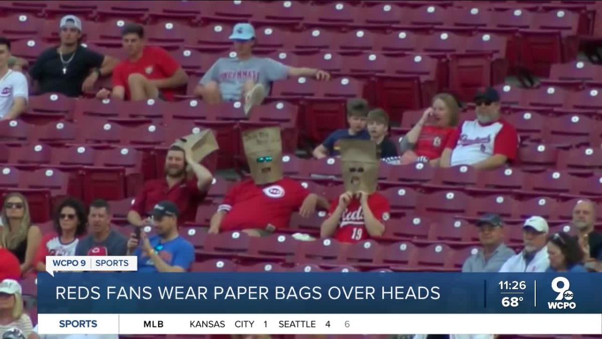 Commanders fans wear paper bags saying 'Sell The Team' amid owner