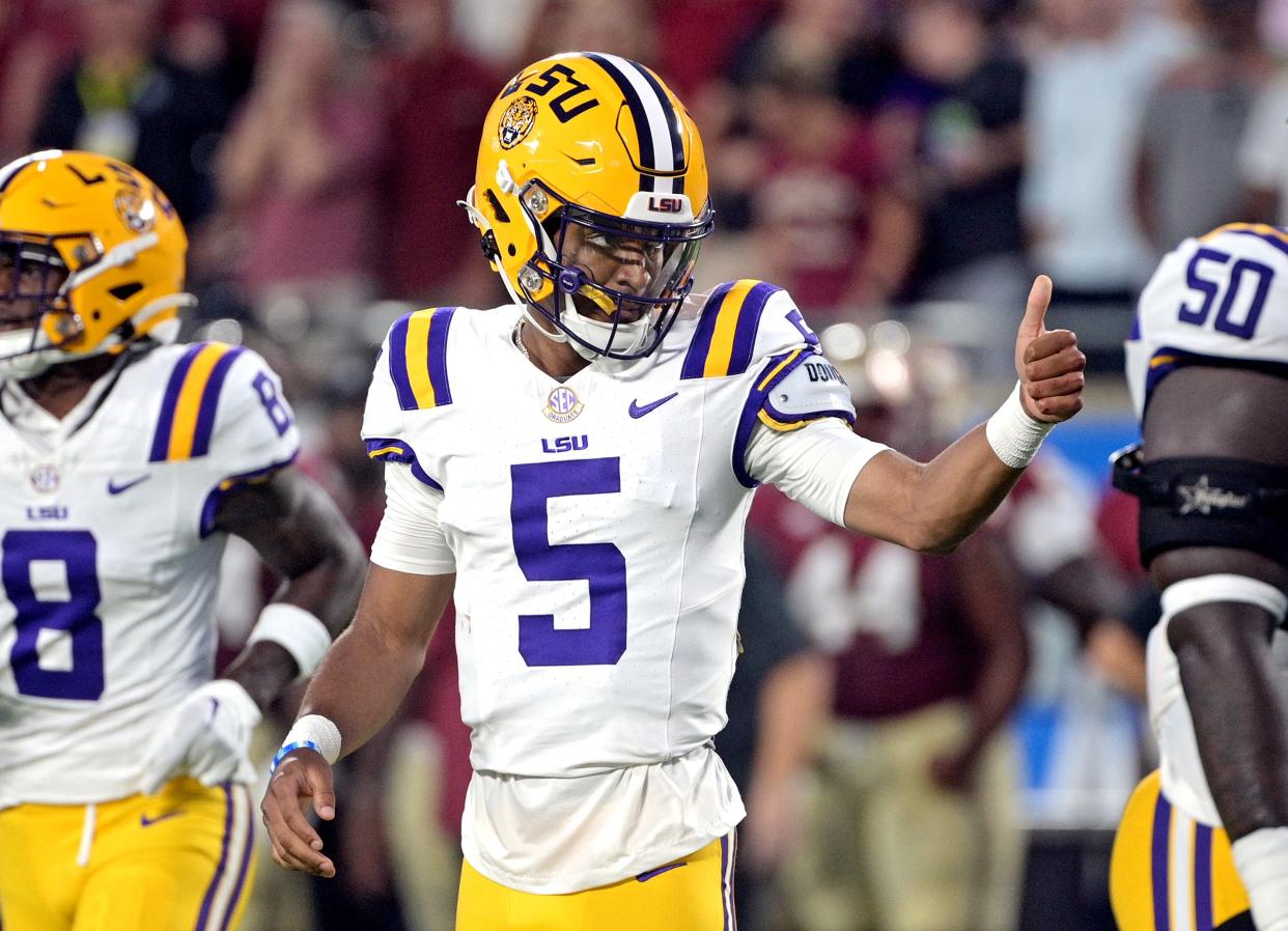 Sep 3, 2023; Orlando, Florida, USA; LSU Tigers quarterback Jayden Daniels (5) gives a thumbs up during the first half against the Florida State Seminoles at Camping World Stadium. Mandatory Credit: Melina Myers-USA TODAY Sports