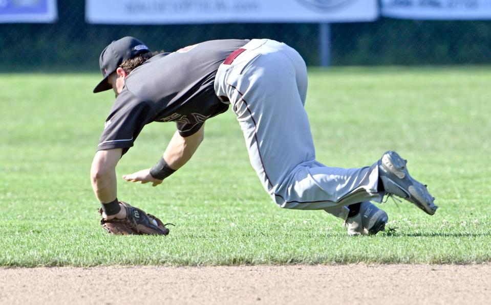 Falmouth shortstop Travis Bazzana make a diving stop that keeps the Brewster runner on second.