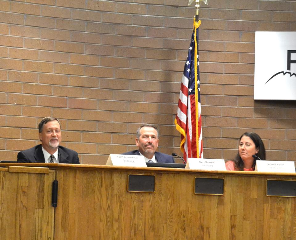 Scott Schoenbauer, left, running unopposed for the District A seat, answers a question during a Poudre School District Board of Education candidate forum put on by the League of Women Voters on Monday in the Fort Collins City Council Chambers in Fort Collins.