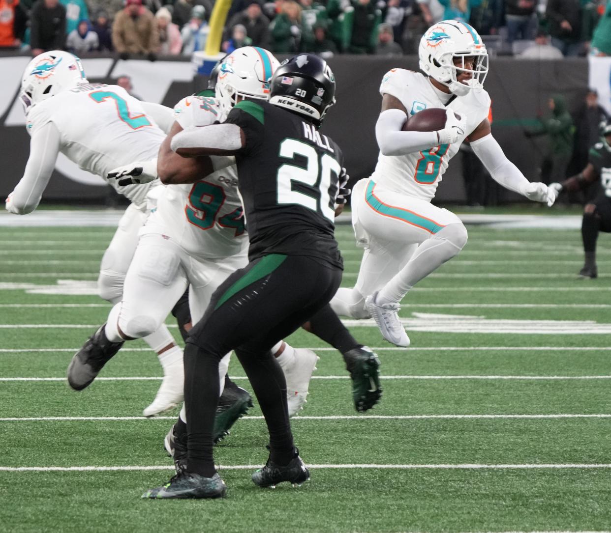 East Rutherford, NJ â€” November 24, 2023 -- Jevon Holland of Miami returns a last second inception 100 yards for a TD in the first half. The NY Jets host the Miami Dolphins at MetLife Stadium on November 24, 2023 in East Rutherford, NJ to play in the first â€œBlack Fridayâ€ NFL game.