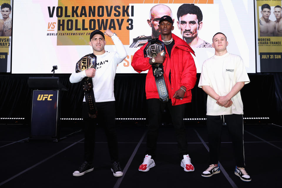 SYDNEY, AUSTRALIA - JUNE 21: Alexander Volkanovski, Israel Adesanya and Kai Kara-France pose during a media opportunity in promotion of UFC 276 (Adesanya v Cannonier) and UFC 277 (Pena v Nunes), at The Star on June 21, 2022 in Sydney, Australia. (Photo by Cameron Spencer/Getty Images for UFC)