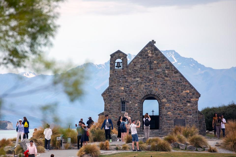 Visitors take pictures of the Church of the Good Shepherd at Lake Tekapo in the central South Island of New Zealand