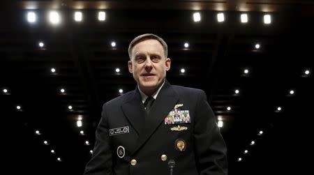 U.S. Navy Admiral Mike Rogers, commander of U.S. Cyber Command, arrives to testify at a hearing held by the Senate Armed Services on Capitol Hill in Washington April 5, 2016. REUTERS/Kevin Lamarque