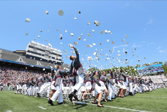 Graduating cadets toss their covers in the air at the end of the 2022 graduation and commissioning ceremony at the U.S. Military Academy at West Point on Saturday.