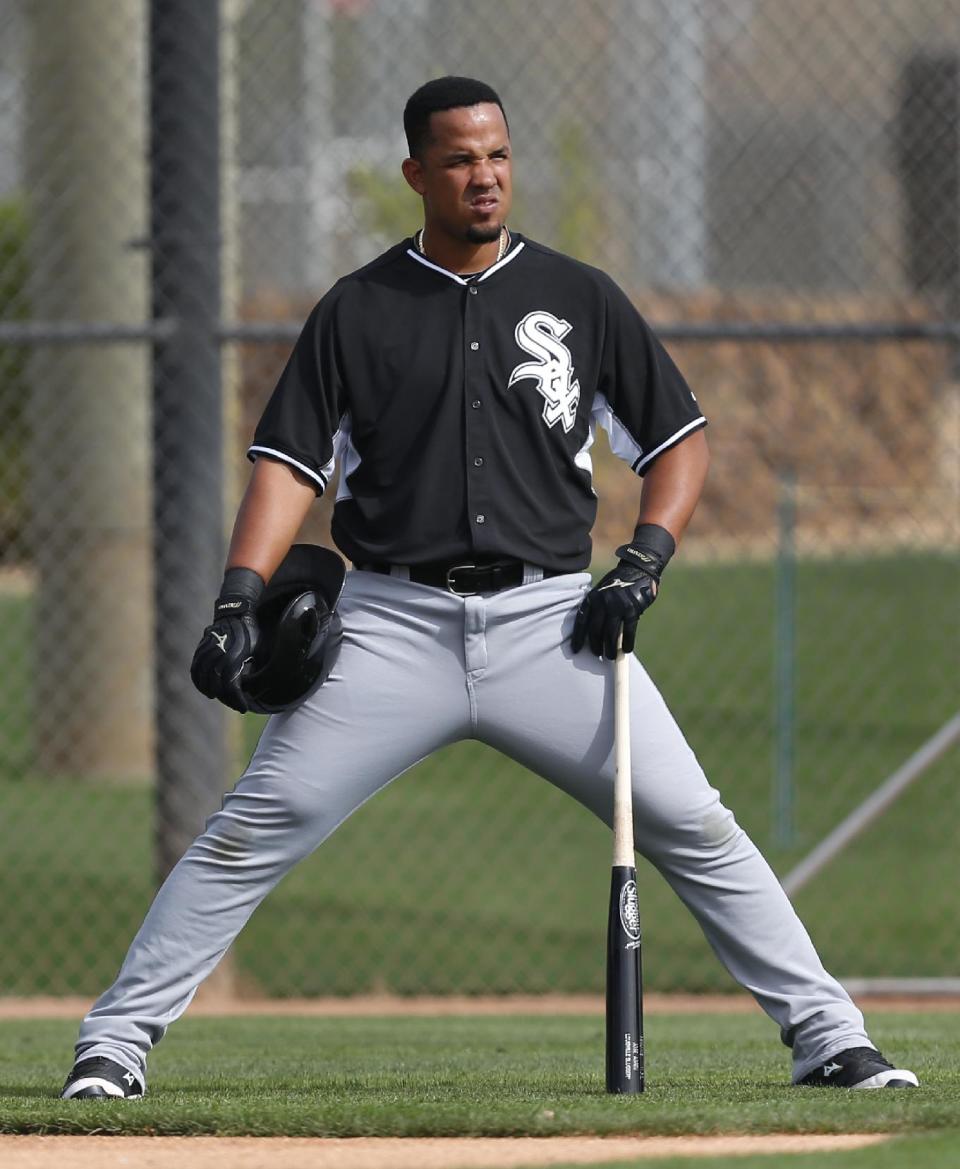 Chicago White Sox's Jose Abreu watches during spring training baseball practice in Glendale, Ariz., Wednesday, Feb. 19, 2014. (AP Photo/Paul Sancya)