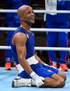 <p>Team Cuba's Roniel Iglesias falls to his knees after winning the gold medal against Pat McCormack of Team Great Britain during the Men's Welter (63-69kg) final at Kokugikan Arena on August 3.</p>