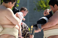 TOKYO - APRIL 25: Sumo wrestling students hold babies as they try to make them cry during the Crying Sumo competition at Sensoji Temple on April 25, 2010 in Tokyo, Japan. The first baby to cry wins the competition. The ceremony takes place in Japan to wish for the good health of the child as it is said that crying is good for the health of babies. (Photo by Koichi Kamoshida/Getty Images)