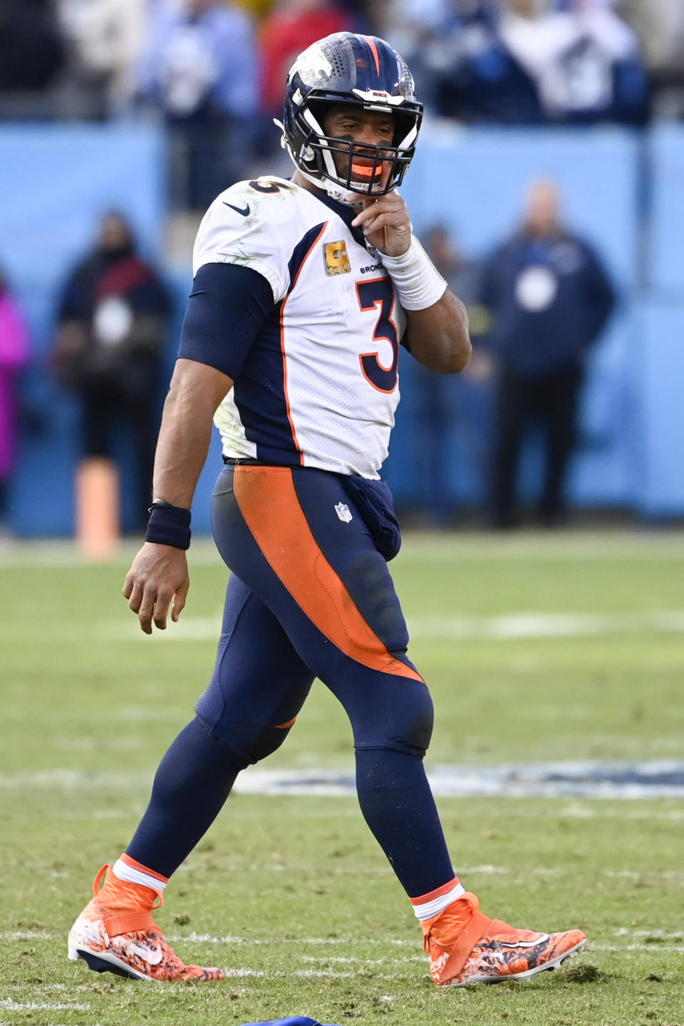 Denver Broncos quarterback Russell Wilson (3) walks off the field in the final seconds of the second half of an NFL football game against the Tennessee Titans, Sunday, Nov. 13, 2022, in Nashville, Tenn. The Tennessee Titans won 17-10. (AP Photo/Mark Zaleski)