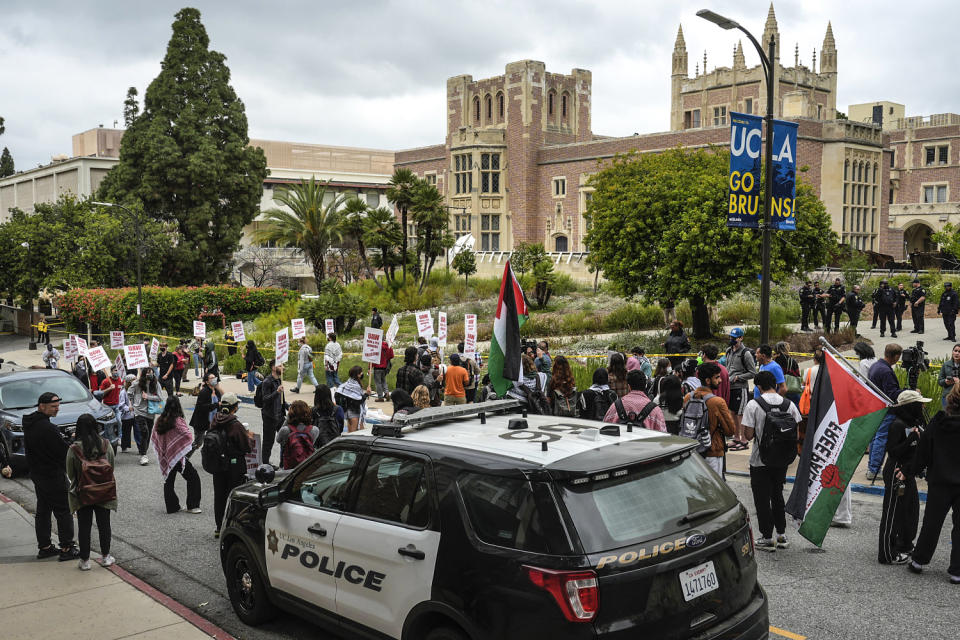 Image: Pro-Palestinian protesters along the campus of UCLA  (Damian Dovarganes / AP)