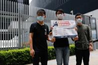 Pro-democracy activists Joshua Wong, Sunny Cheung and Nathan Law speak to the media in response to the national security legislation in Hong Kong