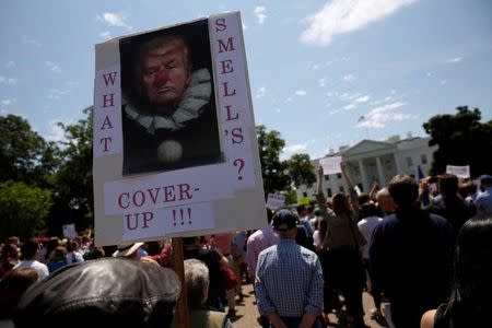 Protesters gather to rally against U.S. President Donald Trump's firing of Federal Bureau of Investigation (FBI) Director James Comey, outside the White House in Washington, U.S. May 10, 2017. REUTERS/Jonathan Ernst