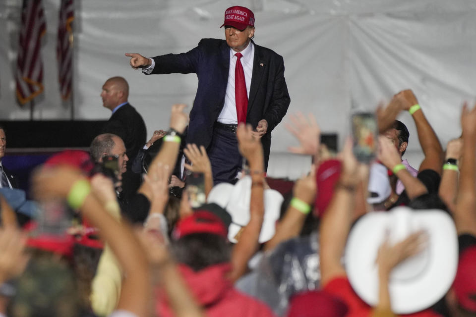 Former President Donald Trump reacts to the crowd after he finished speaking at a campaign rally in support of the campaign of Sen. Marco Rubio, R-Fla., at the Miami-Dade County Fair and Exposition on Sunday, Nov. 6, 2022, in Miami. (AP Photo/Rebecca Blackwell)