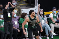 Boston Celtics forward Jayson Tatum (0) and fans celebrate his basket during the second quarter of Game 3 against the Brooklyn Nets in an NBA basketball first-round playoff series Friday, May 28, 2021, in Boston. (AP Photo/Elise Amendola)
