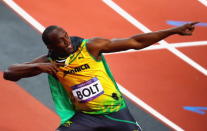 LONDON, ENGLAND - AUGUST 05: Usain Bolt of Jamaica celebrates winning gold in the Men's 100m Final on Day 9 of the London 2012 Olympic Games at the Olympic Stadium on August 5, 2012 in London, England. (Photo by Amin Mohammad Jamali/Gallo Images/Getty Images)