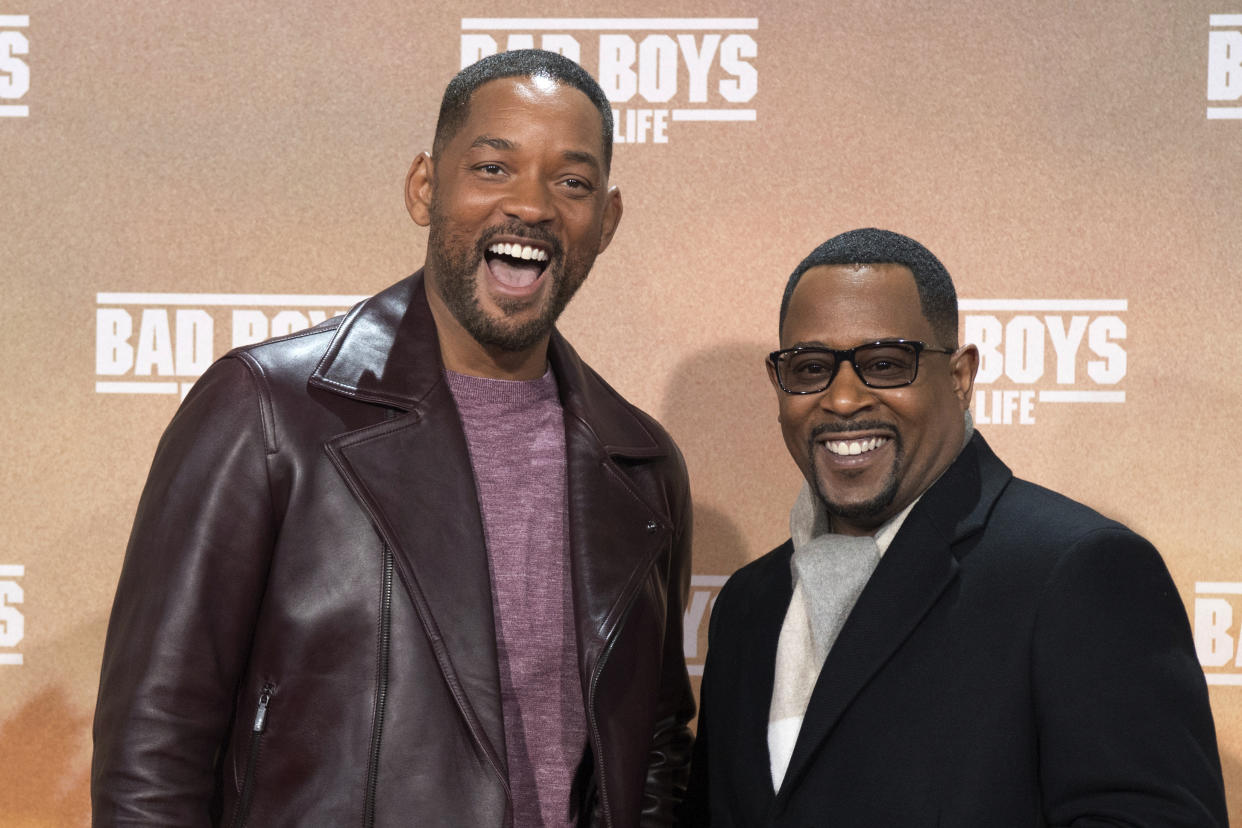 Actors Will Smith, left, and Martin Lawrence pose for the media on the red carpet, for the German premiere of "Bad Boys For Life", in Berlin, Tuesday, Jan. 7, 2020. (Jorg Carstensen/dpa via AP)