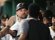 FILE PHOTO: Jul 28, 2018; Pittsburgh, PA, USA; Pittsburgh Pirates shortstop Jordy Mercer (10) high-fives in the dugout after scoring a run against the New York Mets during the seventh inning at PNC Park. Mandatory Credit: Charles LeClaire-USA TODAY Sports