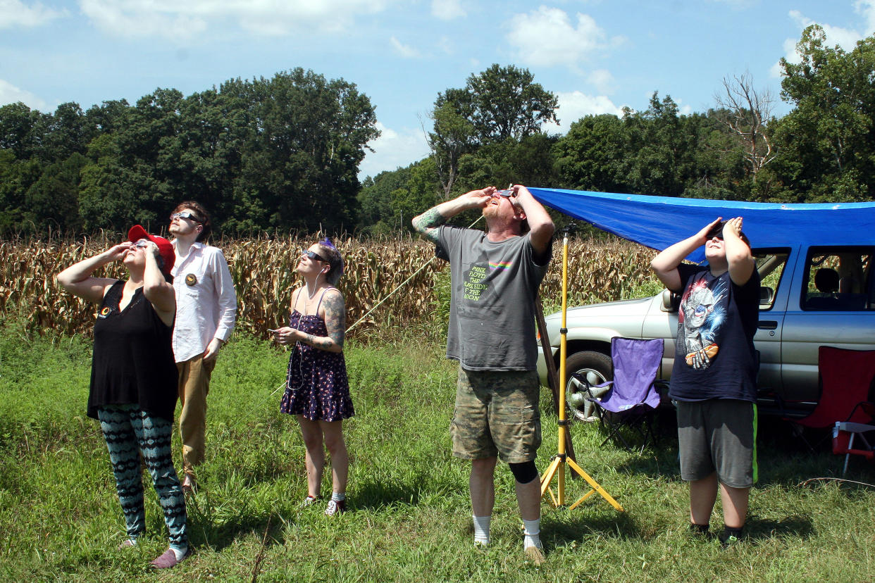 2017: People use special glasses to watch the beginning of a solar eclipse in Cross Plains, Tenn. 