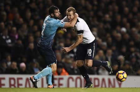 Britain Football Soccer - Tottenham Hotspur v Swansea City - Premier League - White Hart Lane - 3/12/16 Tottenham's Harry Kane in action with Swansea City's Jordi Amat Reuters / Dylan Martinez Livepic