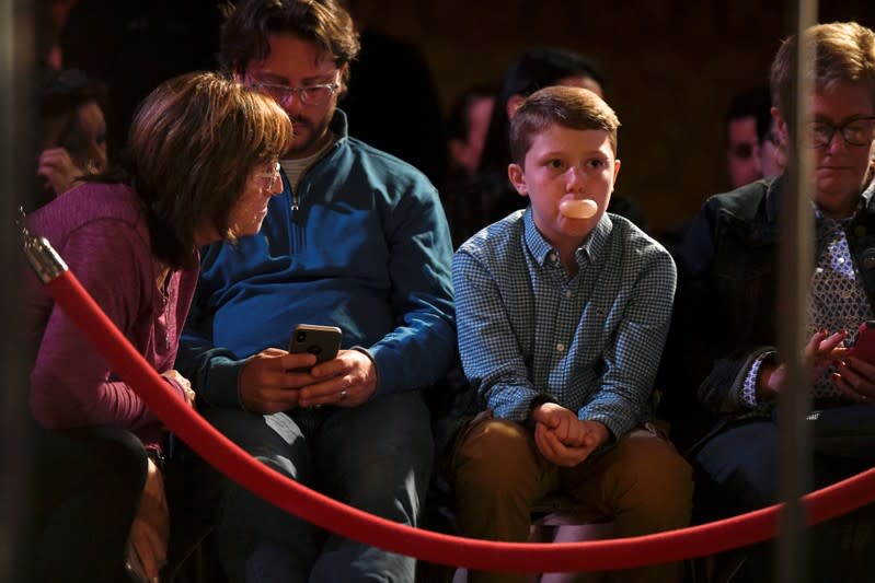 A boy blows gum bubbles while awaiting Democratic presidential candidate and former Vice President Joe Biden to speak in Scranton