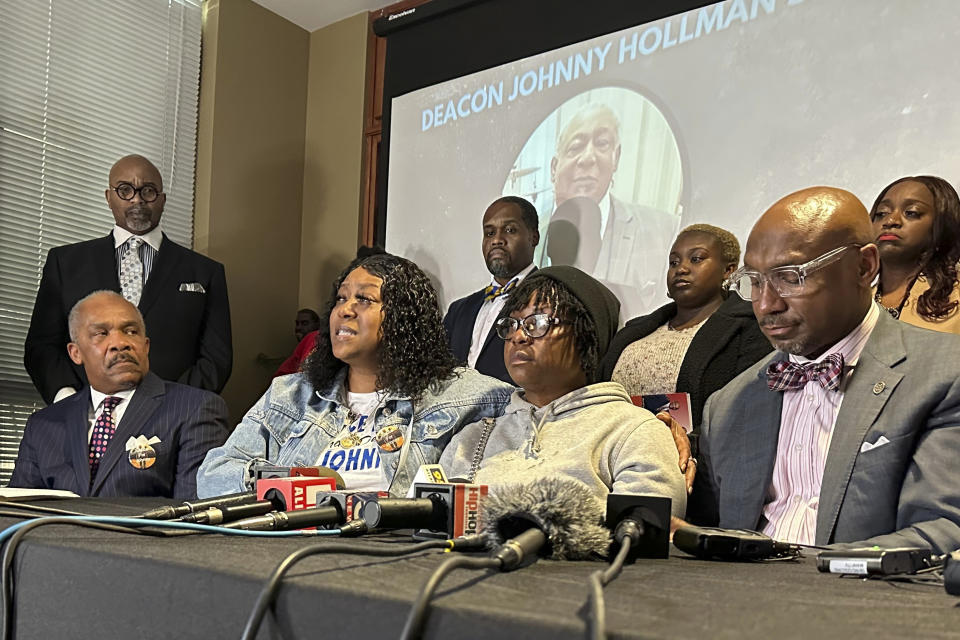 FILE - Arnitra Hollman, seated second from left, speaks during a news conference announcing a lawsuit over the death of her father, Johnny Hollman in Decatur, Ga., Thursday, Jan. 18, 2024. The Atlanta City Council has agreed to pay $3.8 million to settle a lawsuit by the family of Hollman, a church deacon who died in a struggle with a city police officer following a minor car crash. (AP Photo/Sudhin Thanawala, File)