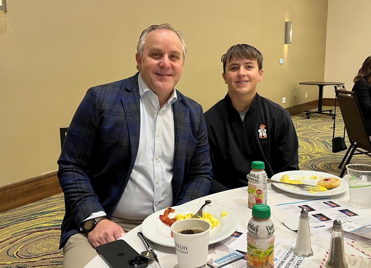 Senate Pro Tempore Greg Treat and his son, Mason, pause for a photograph at a legislative breakfast in Edmond recently.