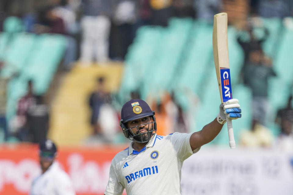 India's captain Rohit Sharma celebrates his century on the first day of the third cricket test match between India and England in Rajkot, India, Thursday, Feb. 15, 2024. (AP Photo/Ajit Solanki)