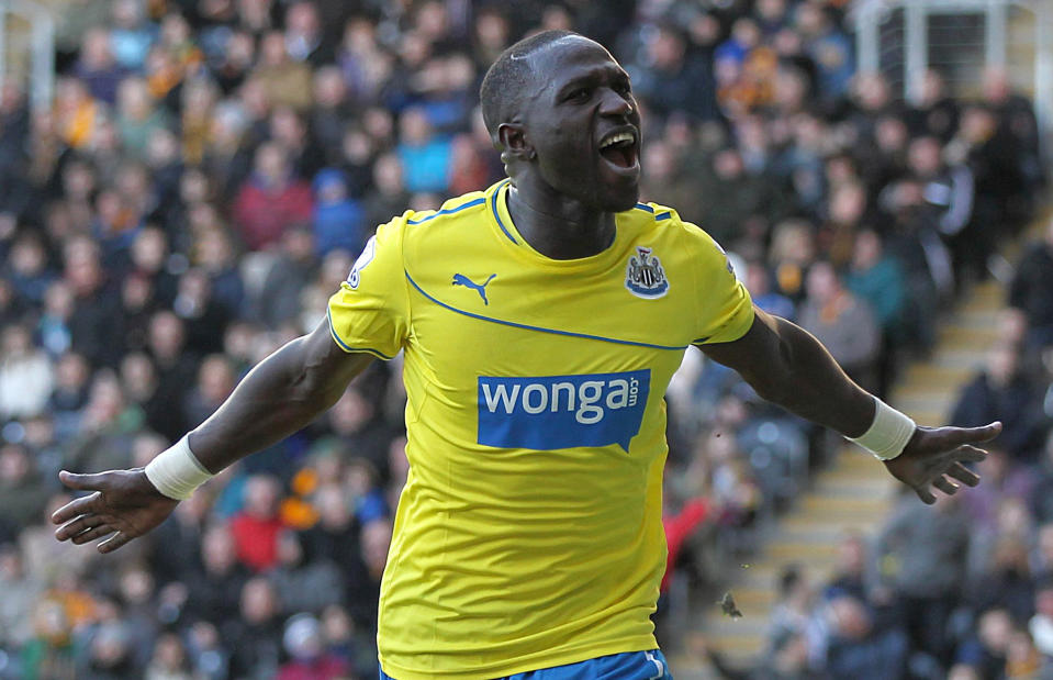 Newcastle United's Moussa Sissoko, celebrates scoring his second goal of the game against Hull during the English Premier League match at the KC Stadium, Hull England Saturday March 1, 2014. (AP Photo/Lynne Cameron/PA) UNITED KINGDOM OUT