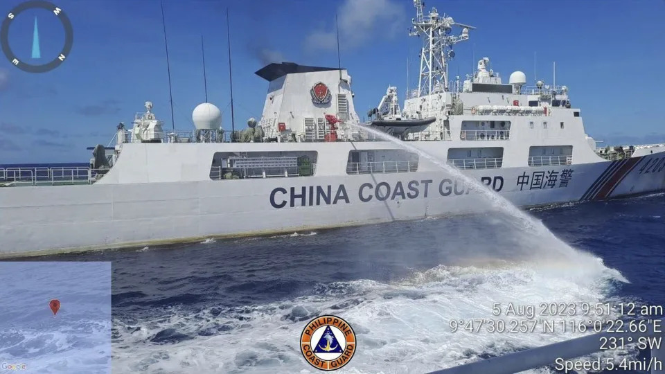 FILE - In this handout photo provided by the Philippine Coast Guard, a Chinese coast guard ship uses water canons on a Philippine Coast Guard ship near the Philippine-occupied Second Thomas Shoal, South China Sea as they blocked it's path during a re-supply mission on Aug. 5, 2023. (Philippine Coast Guard via AP, File)