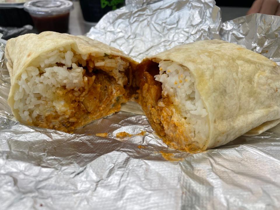 The Nashville hot chicken burrito comes loaded with white rich, crispy chicken, pickles and cheese all topped with a spicy Nashville hot sauce.