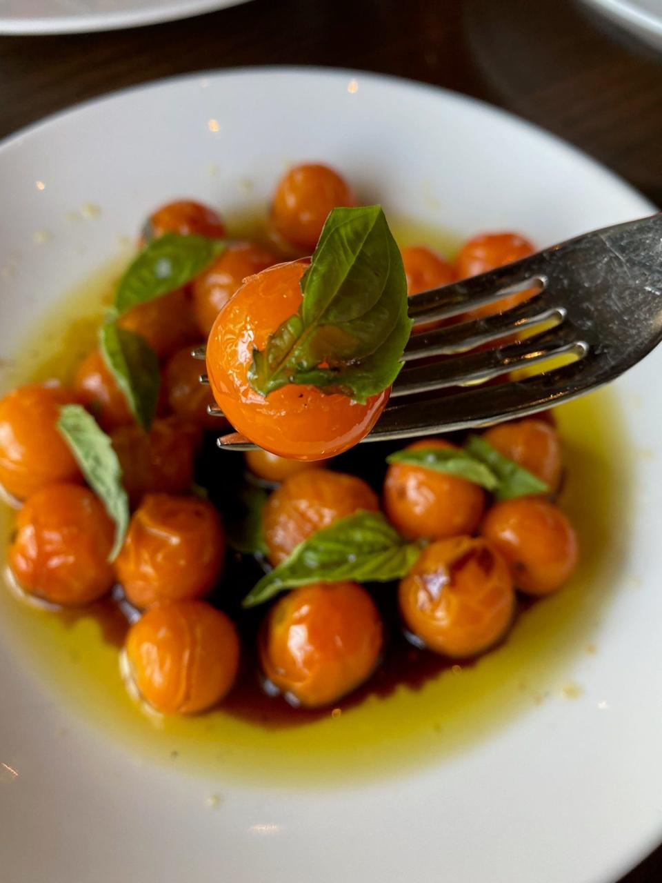 Fresh tomatoes in olive oil, balsamic vinegar, and fresh basil at bar Vetti restaurant in Louisville's NuLu neighborhood.