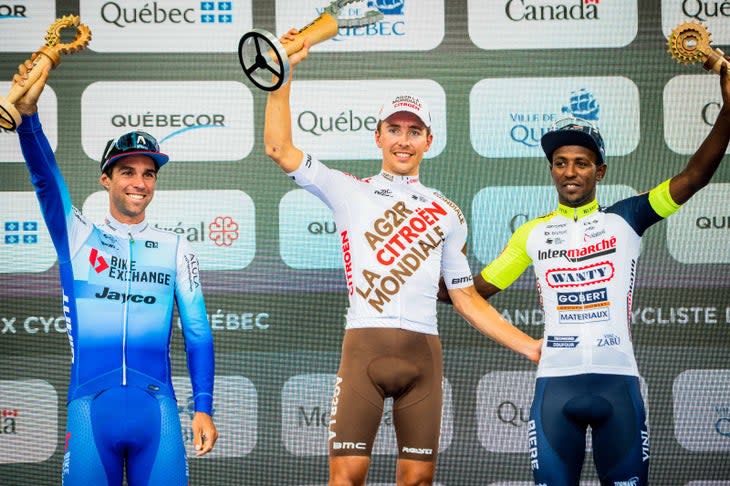 <span class="article__caption">Biniam Girmay, right, celebrates the podium Friday in Quebec.</span> (Photo: James Startt/GPDQM)