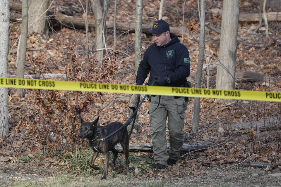 Police search near the home of Sayreville councilwoman Eunice Dwumfour in the Parlin area of Sayreville, N.J., Thursday, Feb. 2, 2023. Dwumfour was found shot to death in an SUV parked outside her home on Wednesday. According to the Middlesex County prosecutor's office, she had been shot multiple times and was pronounced dead at the scene. (AP Photo/Seth Wenig)