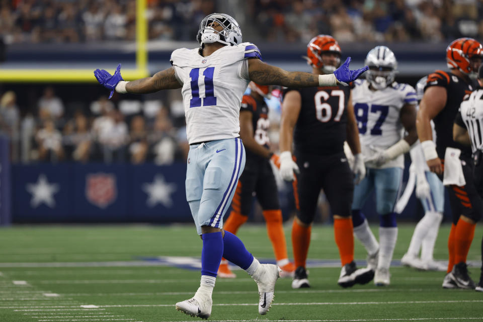 Dallas Cowboys linebacker Micah Parsons (11) celebrates sacking Cincinnati Bengals quarterback Joe Burrow (9) during the second half of an NFL football game Sunday, Sept. 18, 2022, in Arlington, Tx. (AP Photo/Ron Jenkins)