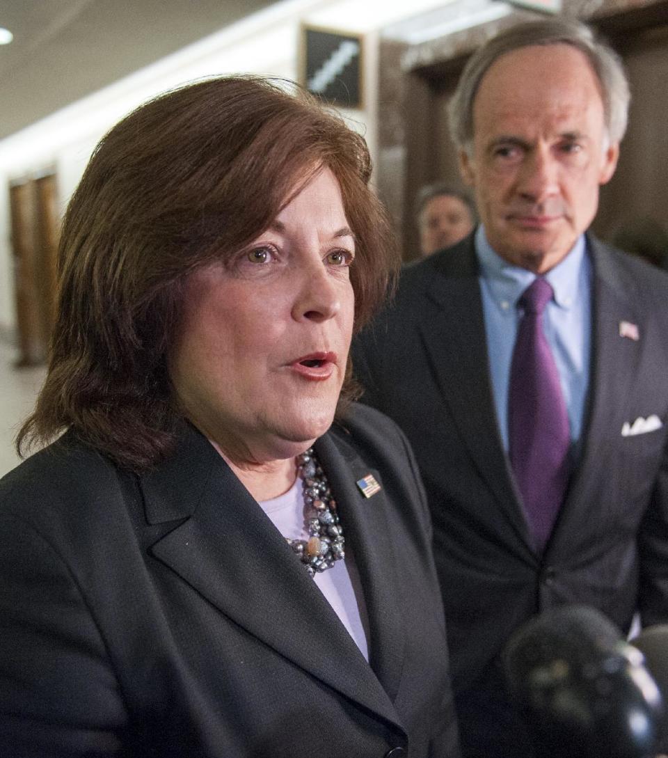 United States Secret Service director Julia Pierson speaks with reporters as Senate Homeland Security Committee Chairman Tom Carper, D-Del., listens after they departed a committee hearing on recent Secret Service agents behavior, on Capitol Hill in Washington, Tuesday, April 1, 2014. (AP Photo/Cliff Owen)