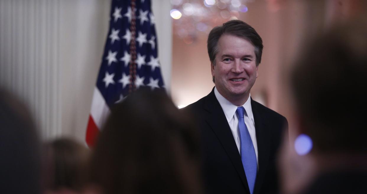 Brett Kavanaugh, associate justice of the U.S. Supreme Court, smiles as U.S. President Donald Trump speaks during a ceremonial swearing-in event in the East Room of the White House in Washington, D.C., U.S., on Monday, Oct. 8, 2018.&nbsp; (Photo: Bloomberg via Getty Images)