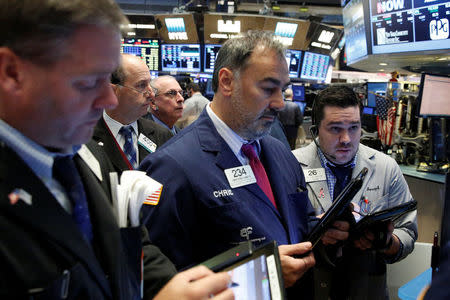 Traders work on the floor of the New York Stock Exchange (NYSE) in New York City, U.S., October 24, 2016. REUTERS/Brendan McDermid