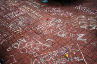 <p>The names of shooting victims are written in chalk in a park across from the historic gay and lesbian bar the Stonewall Inn in New York City on June 13, 2016. An American-born man who had recently pledged allegiance to ISIS, the so-called Islamic State, killed 50 people early Sunday at a gay nightclub in Orlando. The massacre is the deadliest mass shooting in U.S. history. (Photo: Spencer Platt/Getty Images) </p>