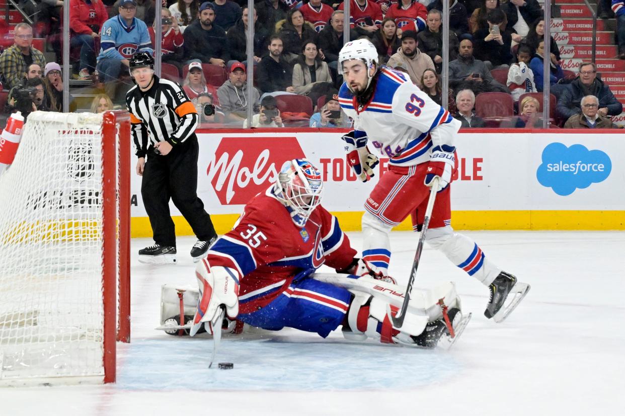 Jan 6, 2024; Montreal, Quebec, CAN; Montreal Canadiens goalie Sam Montembeault (35) stops New York Rangers forward Mika Zibanejad (93) during the shootout period at the Bell Centre.