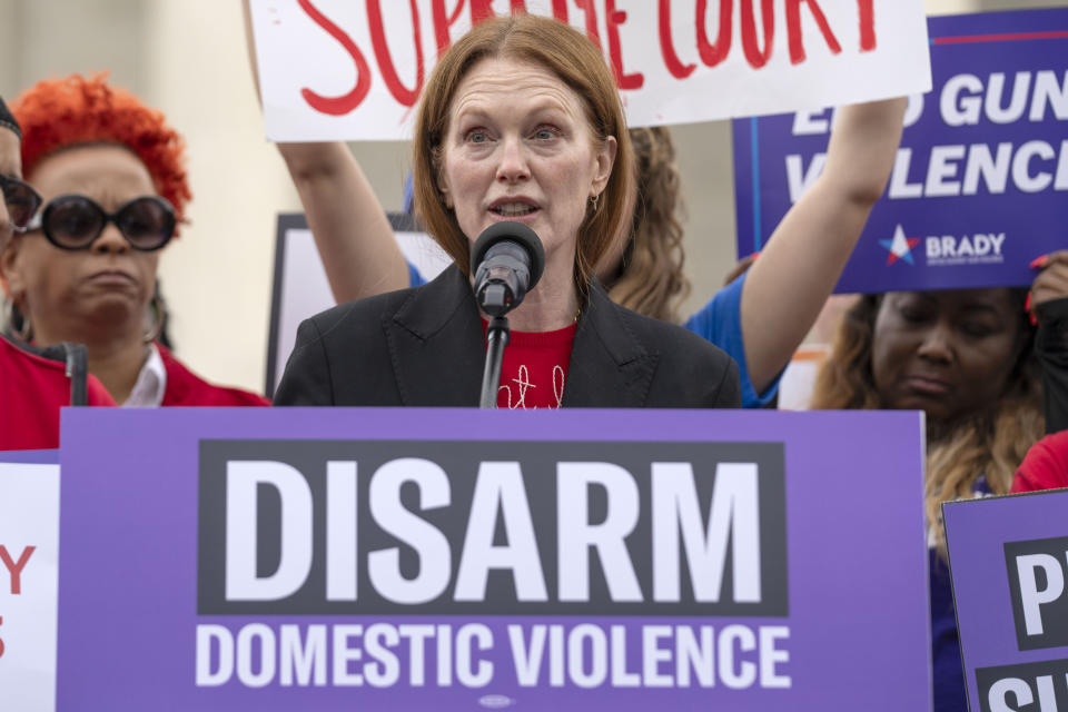 Actor Julianne Moore speaks during a rally at the Supreme Court on Tuesday, Nov. 7, 2023, in Washington. The Supreme Court is taking up a challenge to a federal law that prohibits people from having guns if they are under a court order to stay away from their spouse, partner or other family members. (AP Photo/Mark Schiefelbein)